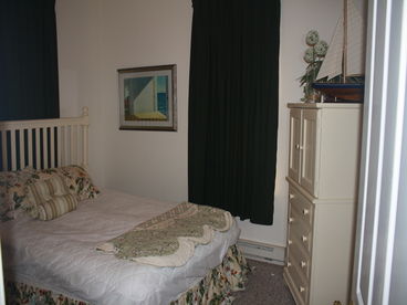 Master bedroom.  There is a TV in the white dresser.