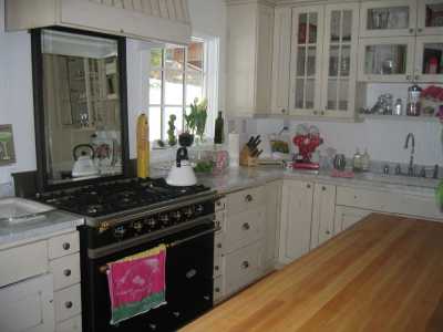 marble counter tops.  Butcher block island.  Stainless steel appliances.  Imported dual fuel French stove.