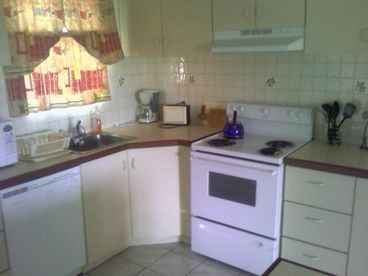 Kitchen is fully equipped and includes all pots, pans, microwave, dishwasher, coffee maker and more