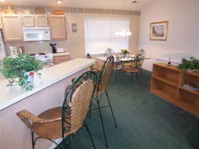 The kitchen is fully equipped plus a dining table seats four with additional seating for 3 at the bar.