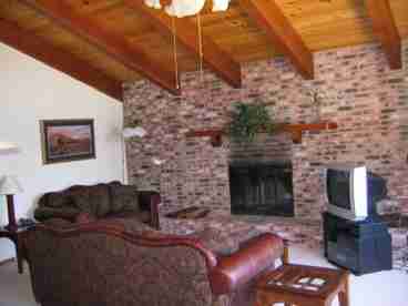 Greatroom with cathedral ceiling and fireplace