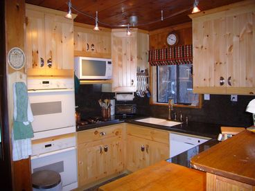 Mom\'s brand new dream kitchen.  All new cabinates, granite, etc.  This beautiful new kitchen has everything, eventwo convection ovens.