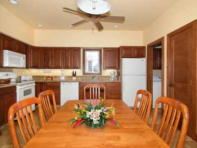 Comfortable dining and a fully-equipped, modern kitchen with granite counters.