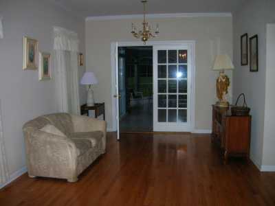 Spacious living room that leads to the sun porch.