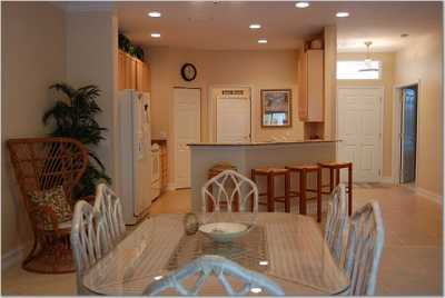 Dining area and modern kitchen area - microwave, dishwasher, granite counters, dishes/glassware/pots/pans included