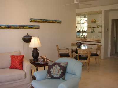 Sophisticated, yet practical (water-proof seats) dining area and wet bar