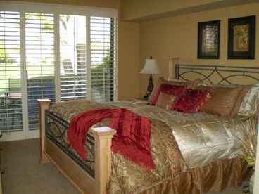Luxurious master bedroom with stunning course views, private bath and king-size bed