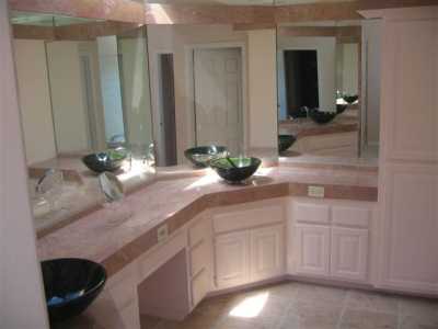 Master bath with double sinks, private toilet and extra large jacuzzi tub