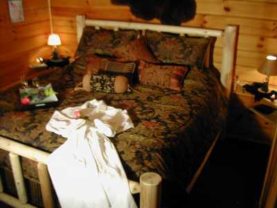 King size log bed with high quality bedding. 23