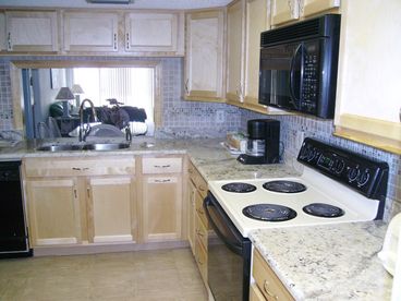 Remolded Kitchen, granite counter, cabinets, doors and floor