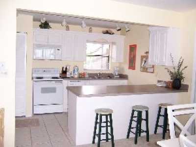 After a long day at the beach, relax in the living room. Recently updated with new paint, furniture and carpet 