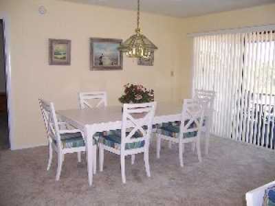 Recently updated dining room with new furniture, paint and carpet. The perfect place for a casual dinner at home. 