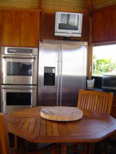 Outdoor gazebo kitchen with ocean view overlooking the swimming pool and golf course