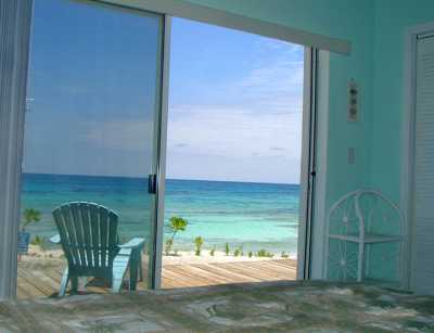 YOUR VIEW OF THE OCEAN WHILE LAYING IN BED EACH MORNING IN THE MASTER BEDROOM SUITE
