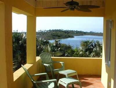THE STUNNING VIEW OUR LAKE FROM THE COVERED DECK.