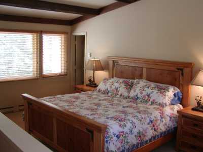 Master bedroom has a king bed, walk in closet, and private bathroom with a 2 man jaccuzi tub.