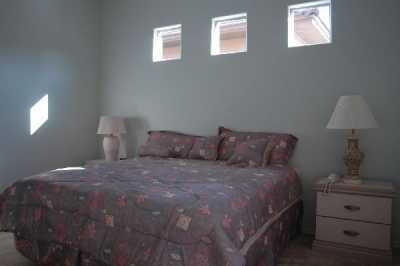 King sized bed with nightstands, TV, and VCR.
