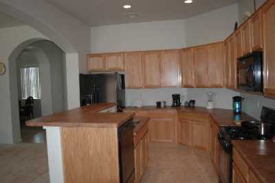 Includes refrigerator with ice-maker, coffee maker, microwave, stove, dishwasher, disposal, stereo and CD player.