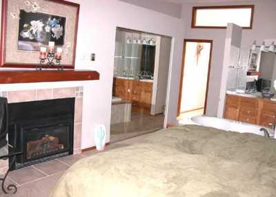 Bedroom with Fireplace & Jetted Tub