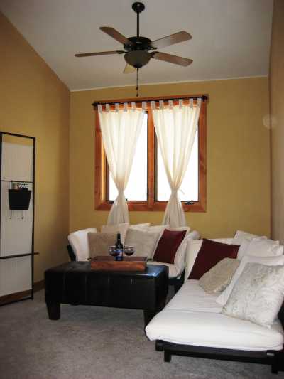Our lovely den has 2 beautiful day beds that fold out to comfortably sleep 2, and a TV w/Direct TV and DVD/VCR combo for movie buffs.