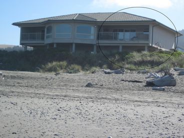 A view of the house from the beach. The suite is shown circled. 