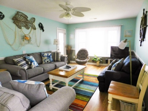 living room with ocean view and access to oceanfront balcony