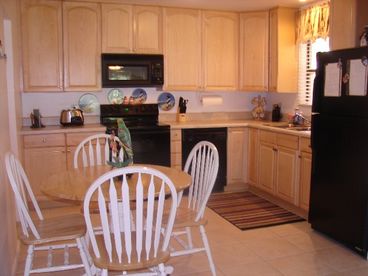 Kitchen is fully equipped with new appliances and has seating for 4. All pots, pans, dishes, and utensils are included to make meals or snacks quick and easy