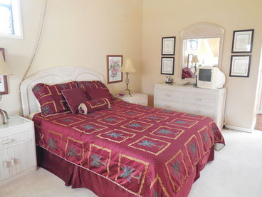Upstairs bedroom with queen bed, full bath, cathedral ceilings and skylights