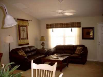 Living room is furnished with 2 full size, leather sofas and entertainment center with TV, DVD and VCR player.