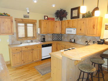 Kitchen & Breakfast Bar- fully stocked kitchen