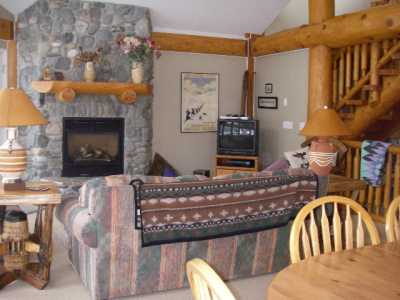 Location plus atmosphere = Happy Skiers
Floor to ceiling river rock fireplace, spectacular views, enjoy apres ski.