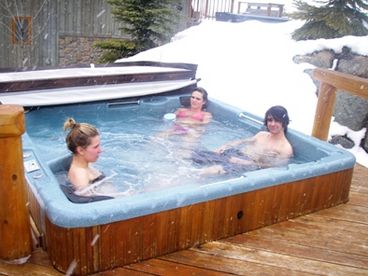 Large 7-8 person hot tub allows easy access from back door.  Sit in kitchen or hot tub and watch skiers fly by or guests enjoying the hot tub.  