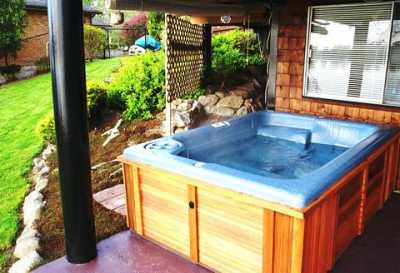 Hot Tub under covered Patio with view of river
