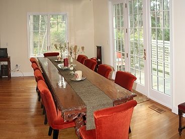 Gorgeous Formal Dining for Ten with French Doors that open to Terrace with grill and view of woods.