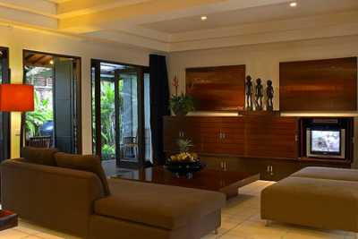 Adjacent to the semi-open living room is a Air-conditioned main livingroom equipped with big sofa, flat TV with cable channels, home theater systems with dvd selection, and an audiophile grade Nakamichi hi-fi system