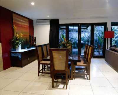 This main dinning area is right besides the sofa inside the AC livingroom, equipped with a teakwood table good for 8 person