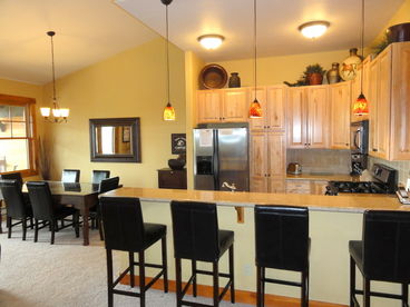 Kitchen Area - granite countertops, hard wood floors, breakfast bar,