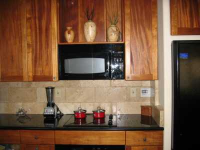 HANDMADE KOA  & MAHOGANY  KITCHEN  CABINETS   

GRANITE COUNTERS