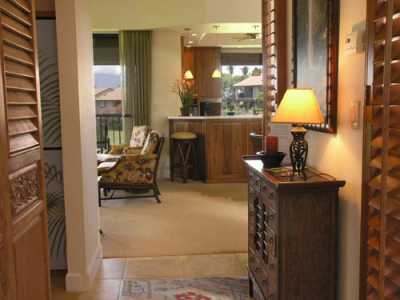 Our entry sets the tone.  High End Hawaiiana with teak plantation shutters, limestone tile and custom furnishings.