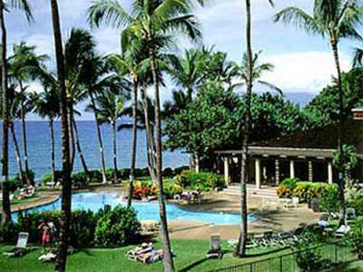 Ekahi\'s ocean front pool is a 2 minute walk from our condo either barefoot down the green belt or on paved parking access
