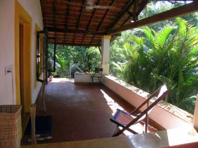 View of the upper floor covered sit out balcony before entering the main entrance door on the left.