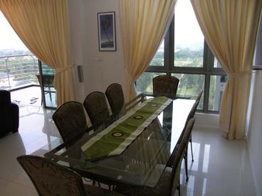  8 Seater dining table, with park views and floor to ceiling windows all round. The open plan living dining area, means everyone can eat at the table and still enjoy the movies 