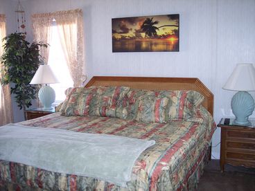 Master bedroom with comfy King Bed, TV, and large full private bathroom with double sinks!