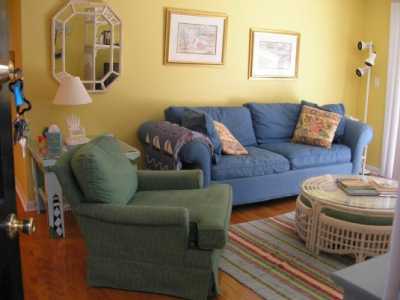 Living room has rocker and sleeper sofa