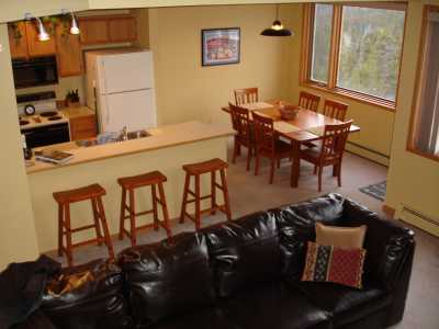 Queen sofa sleeper, gourmet kitchen, and dining area with incredible views