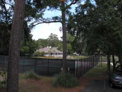 View of Clubhouse and Tennis Courts, lake is between these two