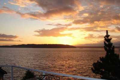 Enjoy breathtaking sunsets from this west-facing home overlooking Puget Sound.