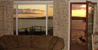 Open the door to the large deck right off the living room.