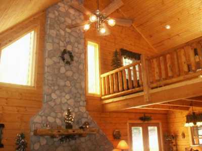 Open Loft w/ Pool table & Sleeper. 2 story Stone Woodburning Fireplace below.