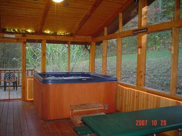 Very private 6 person Hot Tub on screened in porch w/ romantic accent lighting and surrounded by woods.
